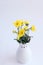 Yellow flowers chrysanthemums in a vase on a white background