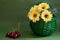 Yellow flowers in green basket