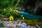 Yellow flowers leaning over a stream of water