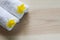 Yellow flowers on white towels with soft shadow on vintage wooden background