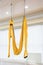 Yellow fly yoga hammock hang on the white background