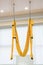 Yellow fly yoga hammock hang on the white background