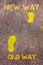 Yellow footsteps on sidewalk from Old Way to New Way messages.Evolution Concept image