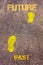 Yellow footsteps on sidewalk from Past to Future message. Concept image