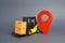 Yellow forklift carries boxes and a red location pointer. Transportation services and logistics management in production warehouse