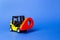 Yellow forklift carries a red location pointer. Destination cargo and parcels, tracking. Technological processes at factory