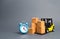Yellow Forklift truck with cardboard boxes and a blue alarm clock. Express delivery concept. Temporary storage, limited offer