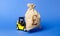 Yellow forklift truck carries a bag of pound sterling. Attracting investment in development, modernization of production