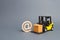 Yellow Forklift truck carries a cardboard box near a email symbol commercial AT. development of Internet network trade. E-commerce