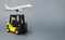 Yellow forklift truck on gray background. Warehouse equipment, vehicle. Logistics and transport infrastructure, industry