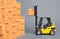 Yellow Forklift truck picks up a box on a pile of boxes. Service storage of goods in a warehouse, delivery and transportation