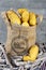 Yellow Fresh potatoes in a jute bag