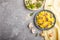 Yellow fried rice with champignons mushrooms, turmeric and oregano on blue ceramic plate on a gray concrete background. top view