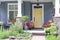 Yellow front door of a small house in the suburbs of Canada