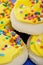 Yellow Frosted Sugar Cookies with Sprinkles