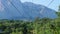 Yellow funicular railcar train in beautiful mountains