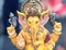 Yellow Ganesh Elephant Hindu god statue closeup focused on face