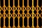 Yellow geometric pattern from folding gate