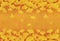 Yellow ginkgo leaves in orange brown background