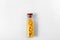 Yellow Globules and Glass Bottle on Light Background. Alternative Homeopathy Medicine, Vitamins and Pills Concept.