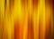 Yellow gold vertically blurred background