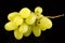 Yellow grape Sultana Thompson Seedless Kishmish on black background