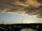 Yellow gray storm clouds. Cumulonimbus dramatic sky wave formation over the city. Weather after the thunderstorm, light