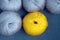 Yellow and gray yarn balls of mohair angora for knitting on the velvet background