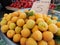 Yellow and green apricots at the counter and turkish inscription apricots on the turkish country market