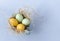 yellow, green, eggs, Easter, nest, blue background