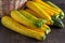 Yellow-green leopard-spotted zucchini. Vegetables on the table. Zucchini harvest.