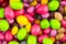 Yellow green pink candy lot dragee colorful panel background bright design design holiday children holiday