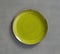 Yellow Green Swirl Melamine Plate with light gray background