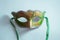 yellow and green Venetian mask on white background