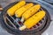 Yellow grilled corn. Street food on the street of Athens, Greece