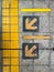 Yellow guiding block brick floor pattern with arrow sign