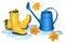 Yellow gumboots in puddle, blue watering can and falling leaves