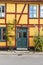 Yellow half-timbered house with green street door Ystad