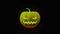 Yellow Halloween Pumpkin glows on black background. Traditional Halloween symbol. Jack-O-Lantern smile and scary eyes