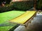 Yellow hammock in the garden of a house