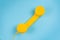 Yellow handset on a blue background