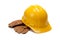 A yellow hard hat and leather work gloves on white