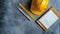 Yellow hard hat, white ruler, and notebook on gray concrete background realistic minimalist photo