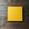 Yellow hardcover photo book isolated on a wooden background with copy space. Top view, flat lay. Blank closed book mockup for