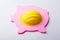 Yellow Hardhat Over Pink Piggybank