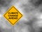 Yellow hazard road sign with Climate Change Ahead message. Bord isolated on a grey sky background. Vector illustration.