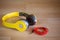 Yellow headphone with 3.5 mm. stereo jack on wood background
