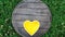 Yellow heart Shaped Porcelain ceramic Bowl on Wooden Background.