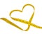 Yellow heart tape measure isolated on the white background