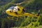 Yellow helicopter landing on Carnic Alps